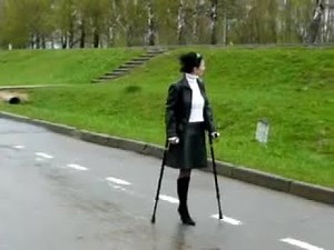 Oldies Amputee woman crutching