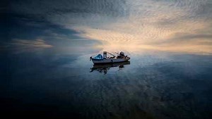 Calm Sea Water Ripples Fishing Boat 4K - Desktop Theme - LiveWallpapers4Free.com