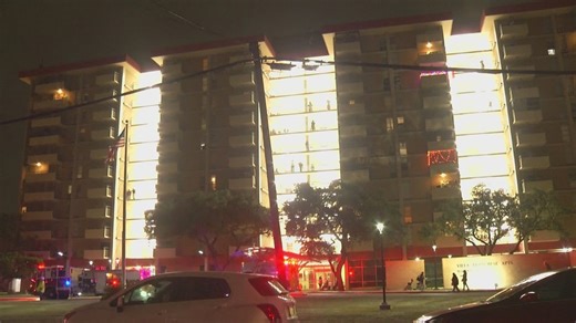 Officials say high-rise apartment fire near downtown was started by cigarette on coffee table