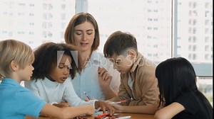 Panorama shot of diverse student and smart teacher drawing and coloring by using marker or crayon at drawing book. Learner using drawing book together in art lesson. Creative activity. Erudition. Stock Video