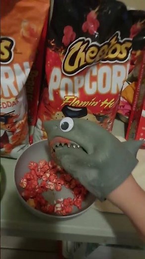 Shark puppet Cheetos Popcorn Cheddar Flamin' Hot