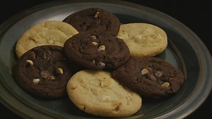 Chocolate cookies on a plate rotating - Free Stock Video