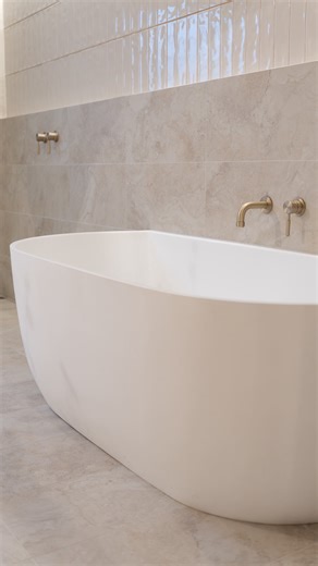 Yabby Bathware on Instagram: "Simon really had his work cut out for him with this one. An old, retro bathroom full of yellow tiles, brown tones and minimal function. But just wait till you see it now! Light, open and so much space. Such a satisfying transformation!  Featuring @tilecloud Byron and Newport Gloss Bone tiles with Warm Brushed Nickel tapware from @yabby.com.au ✨ @pryde.renovations @c.s_plumbing @h_and_gtiling"