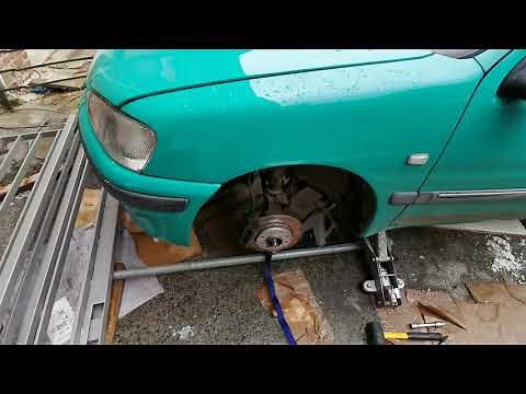 Comment remettre triangle suspension Peugeot 106