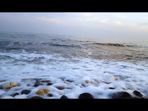 Sea Pebbles in the beach, stone sound, gravel stones with water, waves crashing on rocks