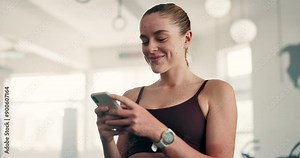 Happy woman, laughing and phone at gym for fitness, workout or training meme, social media and chat. Young person typing on mobile for communication, exercise break and reading message or networking