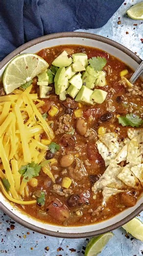 This taco soup recipe is chunky and easy to make with lots of tomatoes, ground beef, beans, chilies, and taco seasonings, loaded with real taco flavor. 🌮🍲 Ingredients: 1 pound ground beef use ground turkey for a healthier, lower calorie option Olive oil as needed 1 small onion chopped 1 jalapeno pepper chopped (use serrano pepper for spicier) 1 bell pepper chopped (or use a 4-ounce can diced green chilies) 4 cloves garlic 1 cup corn (frozen works great here) 3 tablespoons taco seasoning (or mo
