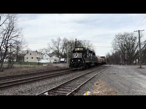 NS 5606 GP38-2 leads CR MA01 at Piscataway with a friendly conductor