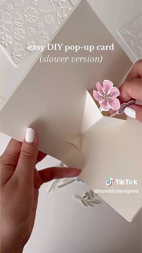 Easy DIY floral pop-up card. ✨ Shop flower stencils here https://www.etsy.com/listing/1509285259/ 🛒 #papercraft #papercraftideas #diypapercraft #diycrafts #handmadecraftideas #diyaesthetic #homemadecraftstosell ##diyartsandcrafts #watercolourpainting #watercolorflowers #watercolortutorial