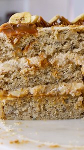 This Banoffee Cake has layers of moist and soft banana cake, filled with dulce de leche and sliced bananas, topped with a delicious Dulce de Leche Cream Cheese Frosting. 🍌 Check out this amazing recipe here: https://www.piesandtacos.com/banoffee-cake/ | Pies and Tacos