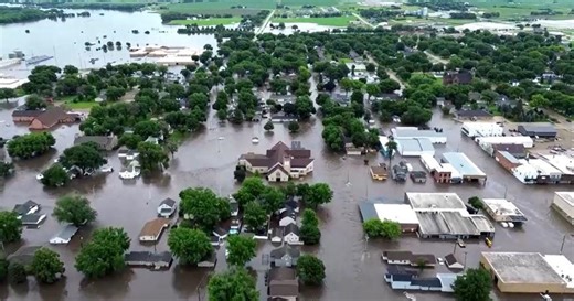 Iowa residents survey fllood damage