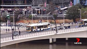 Members of Extinction Rebellion SEQ have blocked two lanes of traffic on Victoria Bridge this morning by suspending themselves from a tripod. www.7NEWS.com.au #7NEWS | 7NEWS Brisbane
