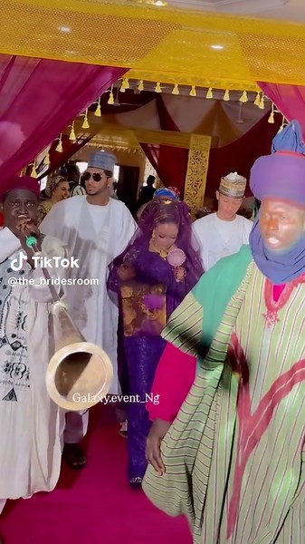 Elegant Bride Entrance with Sibling During Ceremony