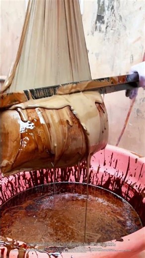 Squeezing Raw Wood Oil Paint from Cloth Bag in Factory