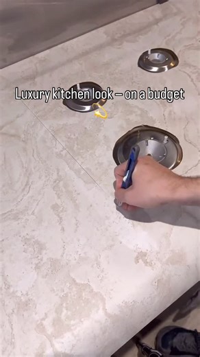 Decordedective US🇺🇸 on Instagram: "Bring the natural travertine look to your kitchen — without renovation 🤍 Easy, affordable, and looks like real stone! 💬 Want the product link? Comment “link” below 👇 #kitchenmakeover #diyhomeprojects #budgetmakeover #diy #interiordesign #decoration #homedecorating #homedecor #homeliving #kitchen"