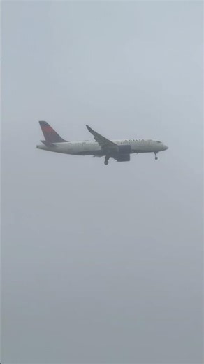 Watch this Delta A220-100 emerge from the clouds at JFK!