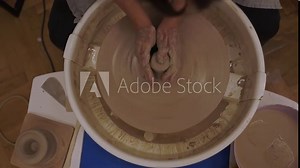 Wheel throwing 4k video. Learning how to model clay into different shapes with pottery wheel. Creating a ceramic bowl by yourself in a pottery class.