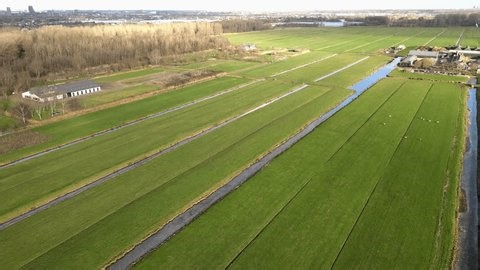 clip-3987618353-aerial-view-neatly-partitioned-farmland-bisected-by