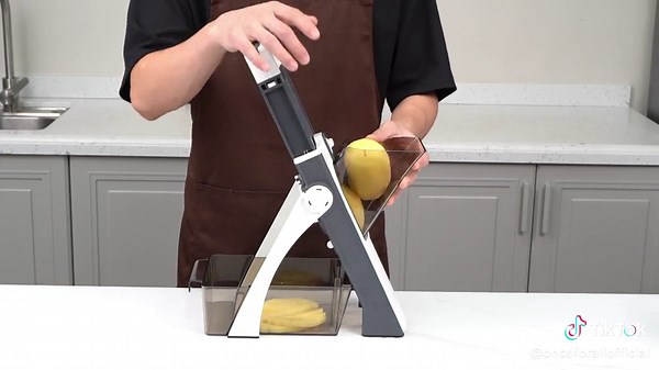 Check out how l effortlessly slice vegetables with this safe mandoline slicer - it's agame-changer in the kitchen! #mandolineslicer #kitchen #kitchengadget #kitchentool #onceforallkitchen #kitchentok