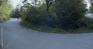 Slow mo running and endurance training, full shot in the curve