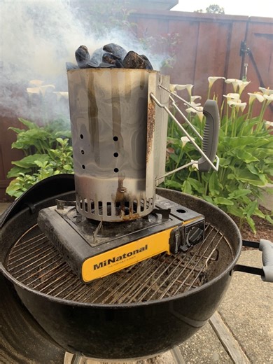 The fastest and easiest way I've found to start a charcoal chimney