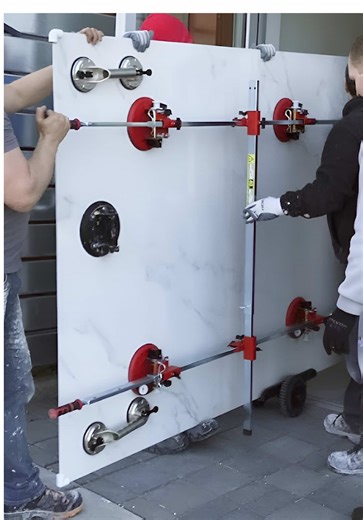 Porcelain Slab Installation at a Dental Office in Surrey, BC. 🔹Our team completed the installation of 24”x24” grey tiles on the floor and 5’x10’ porcelain tiles on the walls. The biggest challenge was transporting the large tiles to the 3rd floor via narrow stairs — the only available access. With the coordinated effort of 7 people, we successfully carried 21 tiles to the upper floor, ensuring a flawless installation. Looking for a trusted partner for your commercial tiling projects? Contact us
