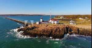 Aerial view of Eastern Point Lighthouse and Gloucester Harbor, Cape Ann, northeastern Massachusetts MA, USA. This historic lighthouse was built in 1832 on the Gloucester Harbor entrance.
