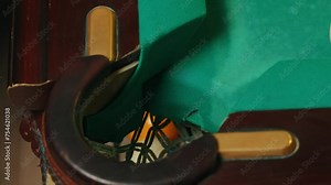 Playing billiard game. White pool ball close-up on green billiards table in pocket. Russian game, Russian pyramid. Billiard balls with numbers on a pool table. Billiards team sport.