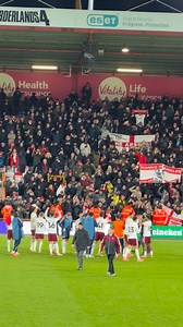 The Arsenal team celebrate with the travelling Gooners after beating Bournemouth 3-2 here at the Vitality | The Gooner