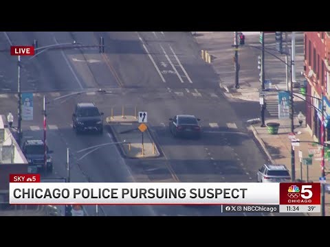 Driver plows through gate in HIGH-SPEED police chase on Chicago's South Side