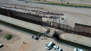 Watch: New drone footage of the border as migrants gather to cross over