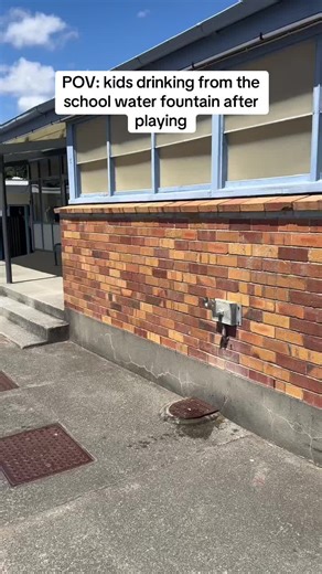 School Kids Refreshing at the Water Fountain