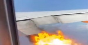 [VIDEO] Flames burst out of plane’s engine during mid-flight, terrified passenger look on