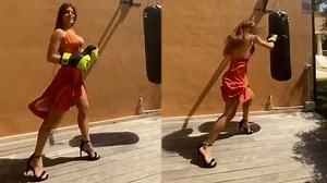 Dressed To Kill: Sexy Chick Showing Off Her Boxing Skills While Wearing A Dress & High Heels!
