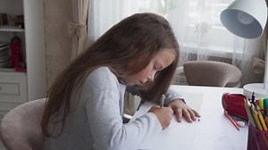 Cute Little Girl Sitting Table Doing Stock Footage Video (100% Royalty-free) 1015922335 | Shutterstock