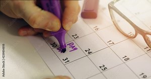 payday - hand with marker circle the day of salary