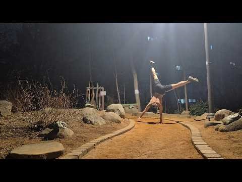 one arm handstand training at night