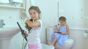 Little girls doing makeup in bathroom - Free Stock Video
