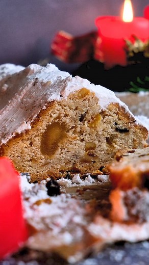 Comment "stollen" and I will send you my recipe! German Christmas Stollen is a traditional fruit bread with nuts, spices, and powdered sugar. It's a popular festive treat in Germany enjoyed during the holiday season. This sweet and rich loaf makes a perfect addition to any Christmas celebration. Try it today! #GermanChristmasStollen #holidaytreats #christstollen #GermanFood #christmascake | My Dinner- Easy German Recipes