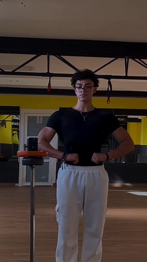 Muscle Flexing Poses in a Gym Setting