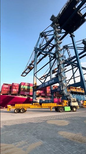 Ship to Shore (STS) gantry crane in action, handling containers from ground to ship -Port Operations