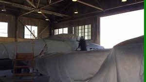 Museum volunteer Ralph Robledo painting the F-84C in preparation for its move in about three weeks to its display site. | Castle Air Museum