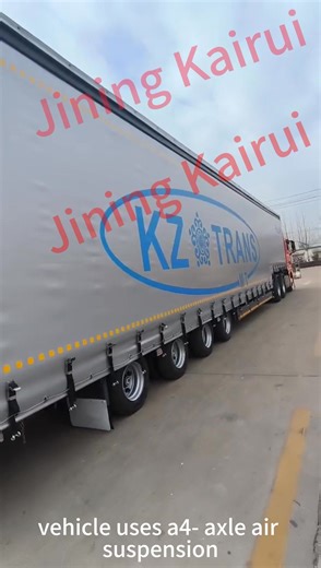 This is a curtain-side semi-trailer. It features side curtains that...
