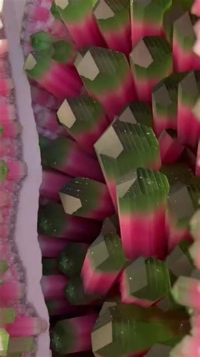 Using a hammer to split a watermelon tourmaline geode