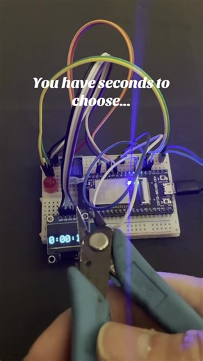 POV: You chose the wrong wire… ESP32 OLED countdown timer buzzer ticking like a bomb. 🔵 Cut blue → Timer speeds up. ⚪ Cut white → EVEN FASTER. ⏳ 3…2…1… 🚨 BUZZER GOES OFF 📵 Screen: “NO SIGNAL” Was there ever a safe wire? 👀 #esp32 #electronics #tech #arduino #viraltech