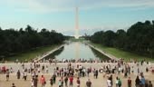 Tourists climb the steps of the Abraham Lincoln Memorial monument by...