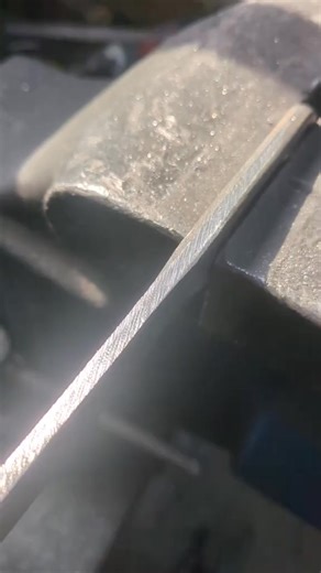 Cutting the jimping into a wrench knife with a checkering file. These grooves improve grip in situations when you brace your thumb on the spine of the knife. #fyp #workshop #foryou #tools | Agnes Benton