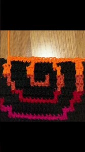 A mosaic crochet rainbow swirl