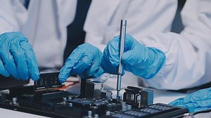 Download Close up portrait of computer engineer's hand is holding CPU's computer. for free