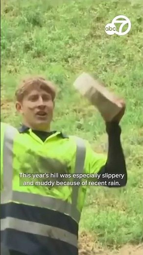 Dozens roll down England hill in annual cheese-chasing race